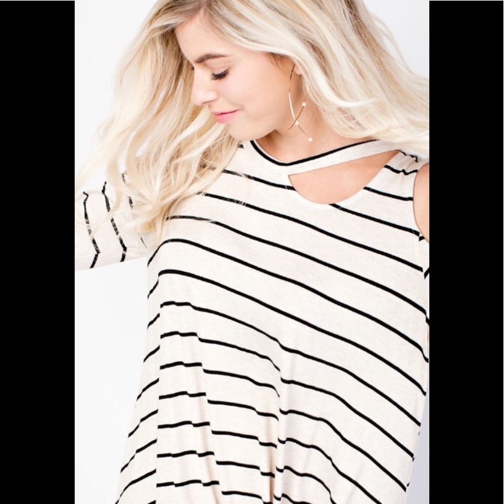 Striped cold shoulder top with knitted hem.